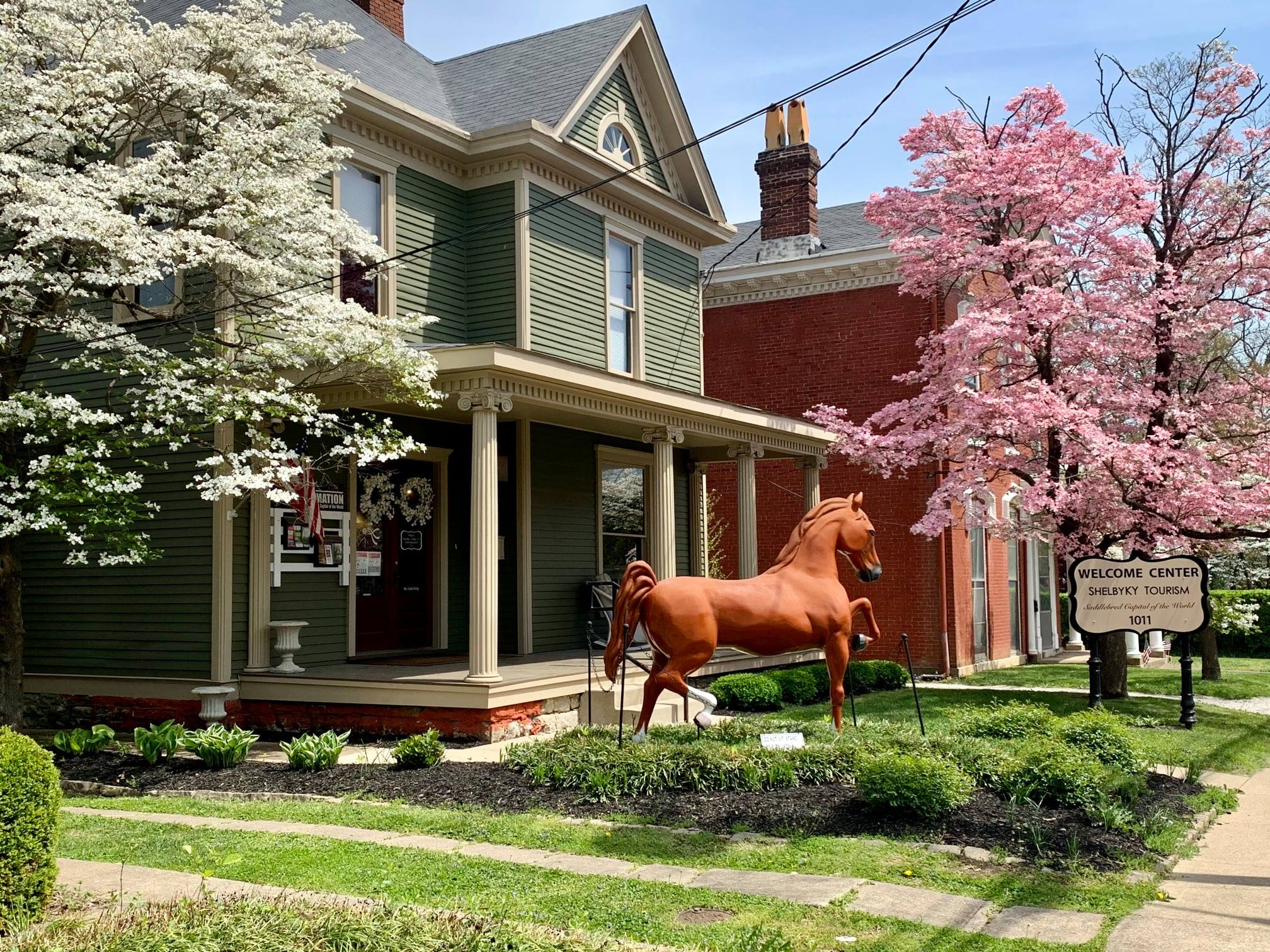Front porch and horse statue in front of Shelby County Welcome Center 