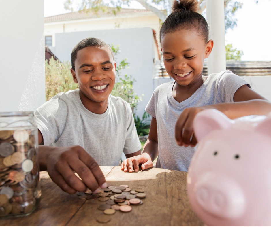 family throwing coins into a piggy bank together