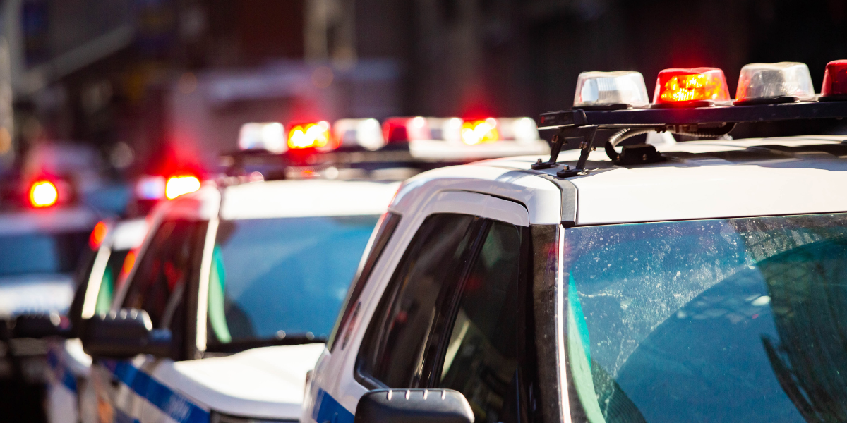 top of cop cars with sirens on