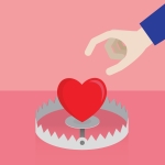 hand reaching for a heart in a trap